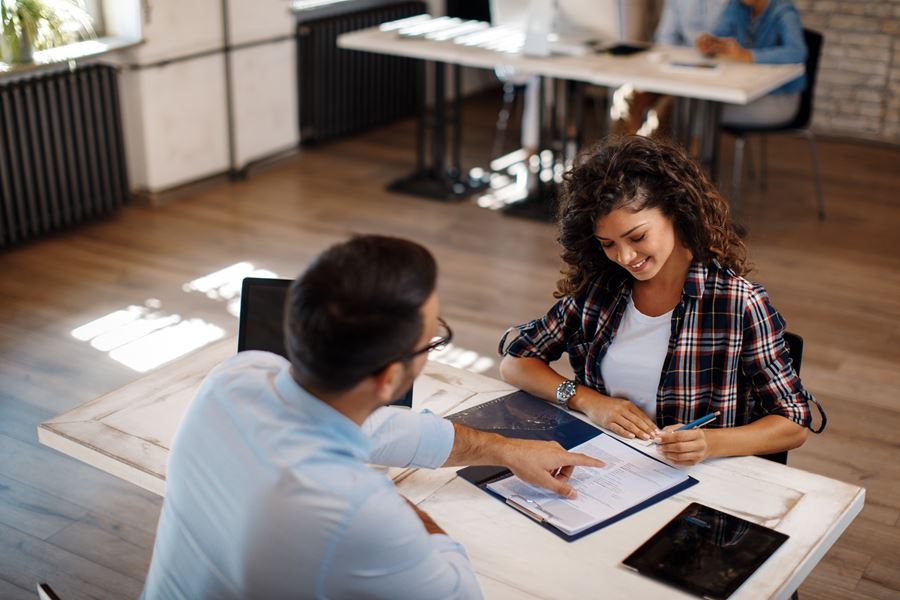 Woman sitting at table getting bank loan