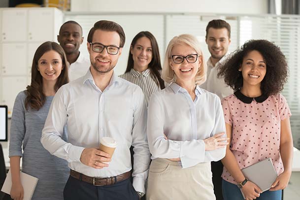 A group of business professionals smiling