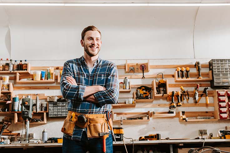 Man standing in front of carpenter business