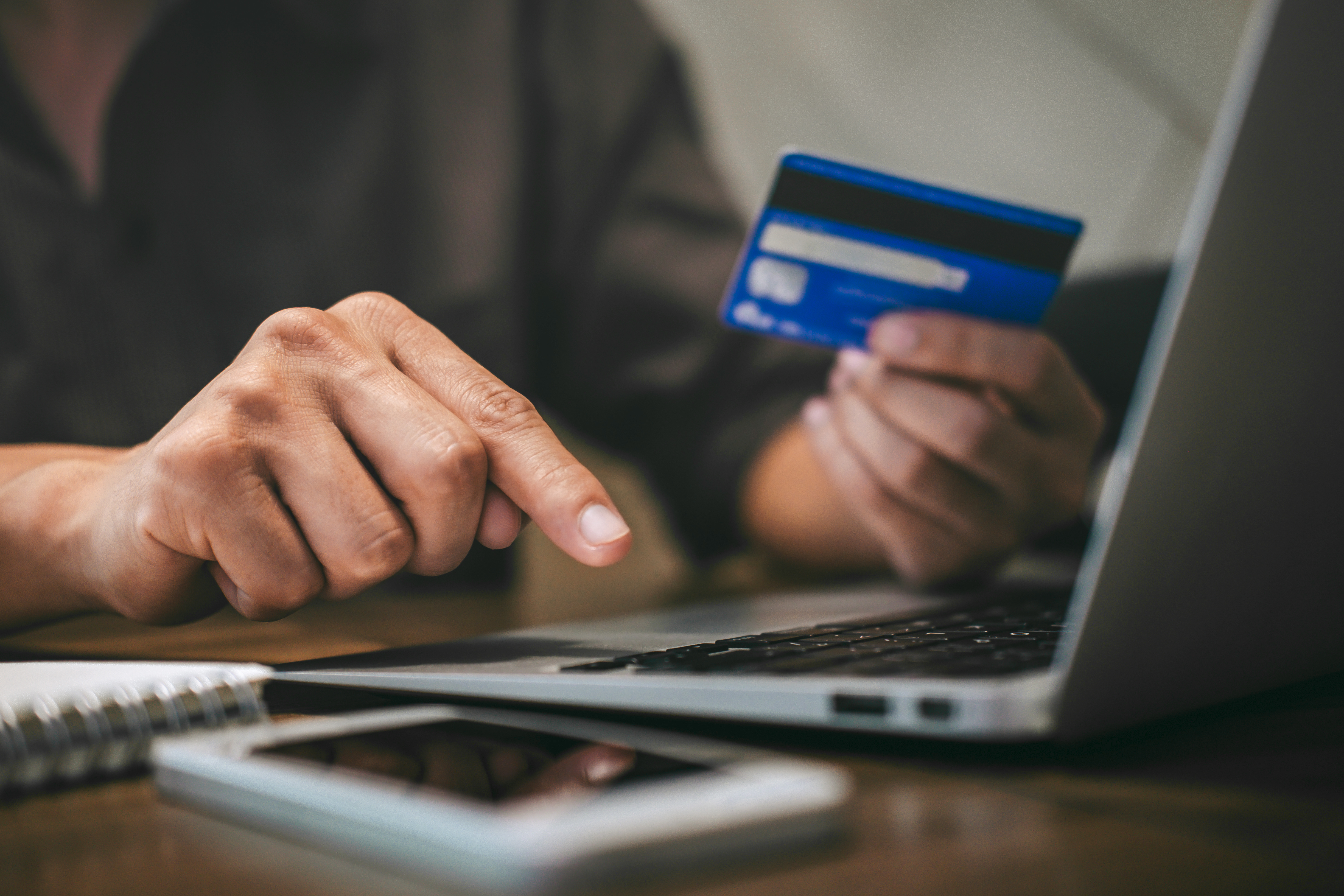 Person using card with a computer