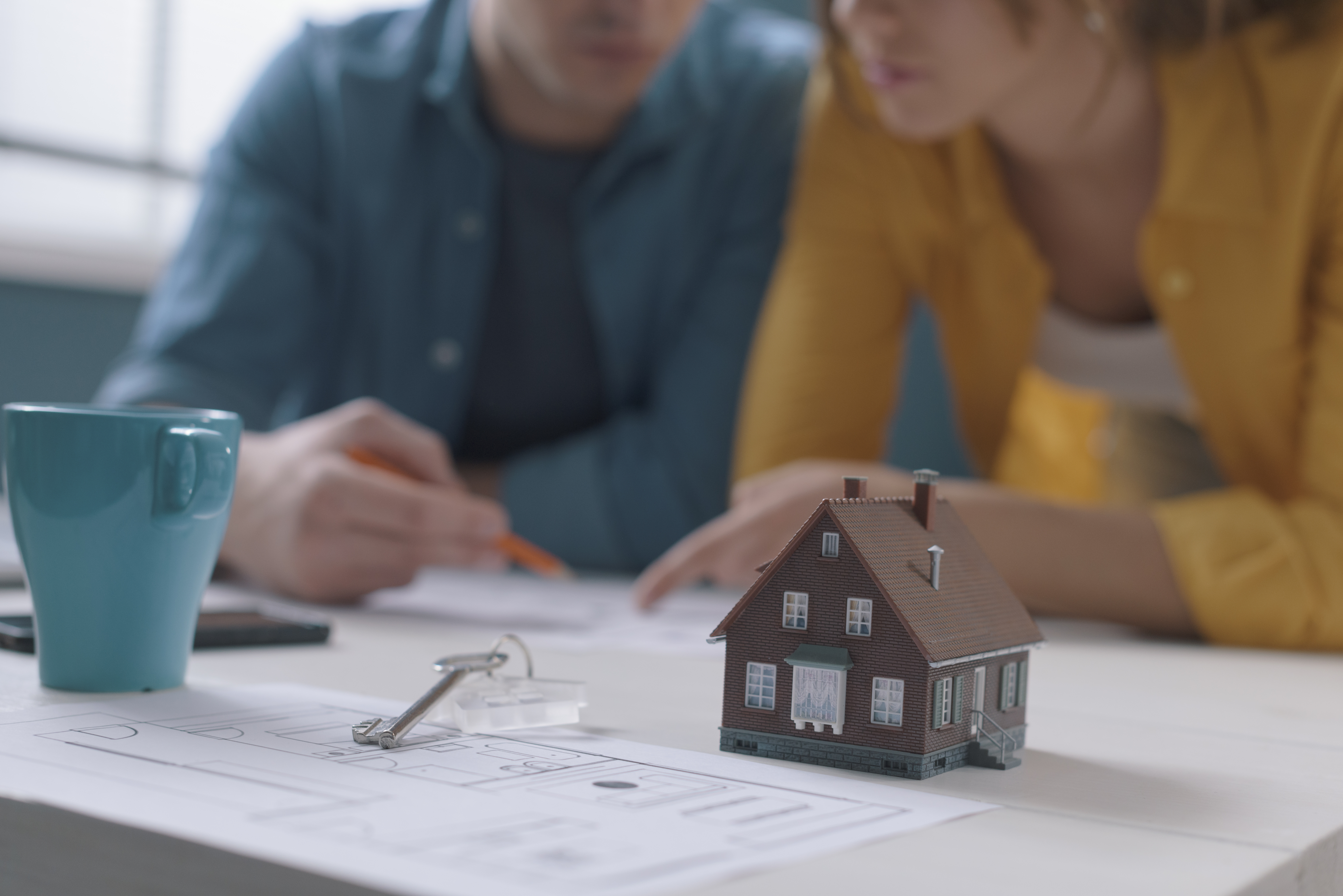 Couple going over mortgage for small home